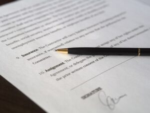 lease agreement document with a pen and signature on it