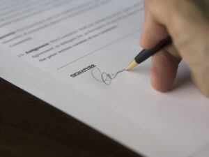 person-signing-a-tenant-contract