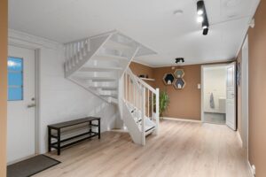 Entrance to home with spiral steps