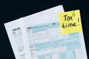 1014 Tax papers with a note reading tax time